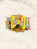 Floral faux leather and felt bow 4.5 inch on clip